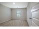 Simple bedroom with neutral walls and carpet at 633 Mill Creek Trl, Jonesboro, GA 30238