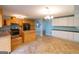 Kitchen with island and light wood cabinets at 218 Groveland Dr, Peachtree City, GA 30269