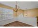 Bright dining room with hardwood floors and chandelier at 362 Summer Hill Cir, Stockbridge, GA 30281