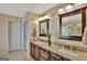 Bathroom boasts dual vanities, granite countertops, and ample storage at 102 Morallion Hls, Peachtree City, GA 30269