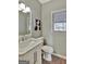 Clean bathroom with marble vanity and updated fixtures at 102 Morallion Hls, Peachtree City, GA 30269