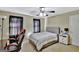 Bright bedroom with a comfortable bed, ample closet space, and ceiling fan at 102 Morallion Hls, Peachtree City, GA 30269