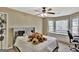 Spacious bedroom with bay window and ceiling fan at 102 Morallion Hls, Peachtree City, GA 30269