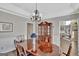 Formal dining room with wood table and view into Gathering room at 102 Morallion Hls, Peachtree City, GA 30269