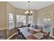 Bright dining room featuring bay window and wood table at 102 Morallion Hls, Peachtree City, GA 30269