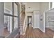 Bright entryway with hardwood floors and a staircase leading to the second floor at 102 Morallion Hls, Peachtree City, GA 30269