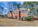 Two-story brick home with a large front yard and landscaping at 102 Morallion Hls, Peachtree City, GA 30269