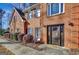 Front entrance of a brick home with dark brown door and landscaping at 102 Morallion Hls, Peachtree City, GA 30269