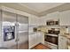 Modern kitchen with stainless steel appliances and granite countertops at 102 Morallion Hls, Peachtree City, GA 30269