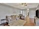 Spacious living room featuring hardwood floors and a view into the kitchen at 102 Morallion Hls, Peachtree City, GA 30269