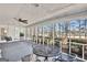 Screened porch with a view of the backyard and a table and chairs at 102 Morallion Hls, Peachtree City, GA 30269