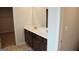 Modern bathroom featuring a dual sink vanity, dark cabinets and a large mirror at 12226 Flannery Ln, Hampton, GA 30228