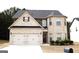 Charming two-story brick home with a two-car garage and manicured landscaping at 12226 Flannery Ln, Hampton, GA 30228