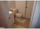 Small bathroom includes white fixtures, tile flooring, and a white sink cabinet at 3248 Brisbane Way, Lithonia, GA 30038
