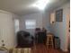 Small dining area with table, chairs, and brown couch at 3248 Brisbane Way, Lithonia, GA 30038