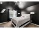 Spacious bedroom with dark walls and a queen bed at 553 Dasheill Ln, Atlanta, GA 30349