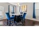 Dining area with a marble table and blue chairs at 553 Dasheill Ln, Atlanta, GA 30349