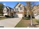 Two-story house with stone accents and a two-car garage at 553 Dasheill Ln, Atlanta, GA 30349