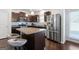 Kitchen island with granite countertop and stainless steel appliances at 553 Dasheill Ln, Atlanta, GA 30349