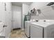 Laundry room with washer, dryer, and shelving at 553 Dasheill Ln, Atlanta, GA 30349