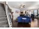 Open living space with dark hardwood floors and a blue couch at 553 Dasheill Ln, Atlanta, GA 30349