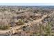 Aerial view of neighborhood with homes and a tree-filled landscape at 811 Somersby Dr, Dallas, GA 30157