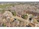 Aerial view of a residential area with houses and lush green surroundings at 811 Somersby Dr, Dallas, GA 30157