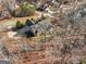 House nestled in a wooded area, aerial view at 811 Somersby Dr, Dallas, GA 30157