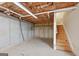 Unfinished basement area with wooden stairs and plumbing at 811 Somersby Dr, Dallas, GA 30157