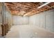 Unfinished basement with exposed framing and concrete walls at 811 Somersby Dr, Dallas, GA 30157