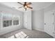 Bright bedroom with large window and ceiling fan at 811 Somersby Dr, Dallas, GA 30157