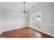 Bright dining room with hardwood floors and wainscoting at 811 Somersby Dr, Dallas, GA 30157