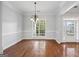 Formal dining room with hardwood floors and large window at 811 Somersby Dr, Dallas, GA 30157