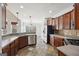 Kitchen with dark wood cabinets and tile flooring at 811 Somersby Dr, Dallas, GA 30157