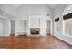 Living room with hardwood floors and a stone fireplace at 811 Somersby Dr, Dallas, GA 30157