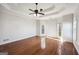 Main bedroom with hardwood floors, ceiling fan, and multiple windows at 811 Somersby Dr, Dallas, GA 30157