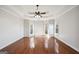 Main bedroom with hardwood floors, ceiling fan, and multiple windows at 811 Somersby Dr, Dallas, GA 30157