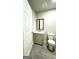 Updated bathroom with gray vanity and modern toilet at 1222 Bronx Nw St, Atlanta, GA 30314