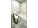 Clean bathroom with a tub, shower, and modern fixtures at 1222 Bronx Nw St, Atlanta, GA 30314