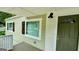 Updated front entrance with a green door and white brick at 1222 Bronx Nw St, Atlanta, GA 30314