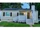 Charming ranch home with a newly renovated exterior, featuring a covered porch and landscaping at 1222 Bronx Nw St, Atlanta, GA 30314