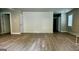 Spacious living area with wood-look flooring and white accent wall at 1222 Bronx Nw St, Atlanta, GA 30314