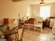 Bright dining area with glass table and white chairs at 561 Commercial Nw Ave, Atlanta, GA 30318