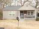 Ranch style home with covered porch and small yard at 561 Commercial Nw Ave, Atlanta, GA 30318