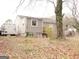 Exterior view of a modest house with a large tree at 561 Commercial Nw Ave, Atlanta, GA 30318