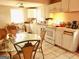 Kitchen with white cabinets, granite counters, and breakfast nook at 561 Commercial Nw Ave, Atlanta, GA 30318