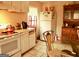 Kitchen with white cabinets, granite counters, and glass table at 561 Commercial Nw Ave, Atlanta, GA 30318