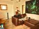 Living room with brown leather sectional and wood floor at 561 Commercial Nw Ave, Atlanta, GA 30318