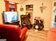 Living area featuring red leather chairs and TV at 561 Commercial Nw Ave, Atlanta, GA 30318