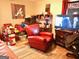 Living room featuring a red leather armchair and TV at 561 Commercial Nw Ave, Atlanta, GA 30318